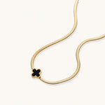 Load image into Gallery viewer, Dainty 18K gold-plated herringbone chain necklace with black enamel quatrefoil clover pendant on white background