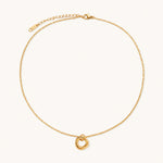 Load image into Gallery viewer, Delicate gold-plated necklace with three interlocking circle rings forming a minimalist knot pendant on cream background