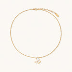 Load image into Gallery viewer, Gold-plated butterfly pendant with iridescent mother of pearl inlay on delicate chain against cream background.