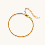 Load image into Gallery viewer, Delicate 18K gold-plated stainless steel bracelet with textured beaded chain on cream background