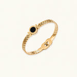Load image into Gallery viewer, Gold mesh bracelet with circular black mother of pearl medallion featuring Roman numeral engravings and hinged clasp
