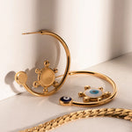 Load image into Gallery viewer, 18k Sailor's Helm Evil Eye Earrings
