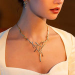 Load image into Gallery viewer, Elegant Two Tone Branch Cross Necklace and Earring Set
