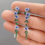 Load image into Gallery viewer, Glossy Blue Floral Dangling Earrings