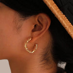 Load image into Gallery viewer, 14k Dainty Textured Spiral Hoop Earrings
