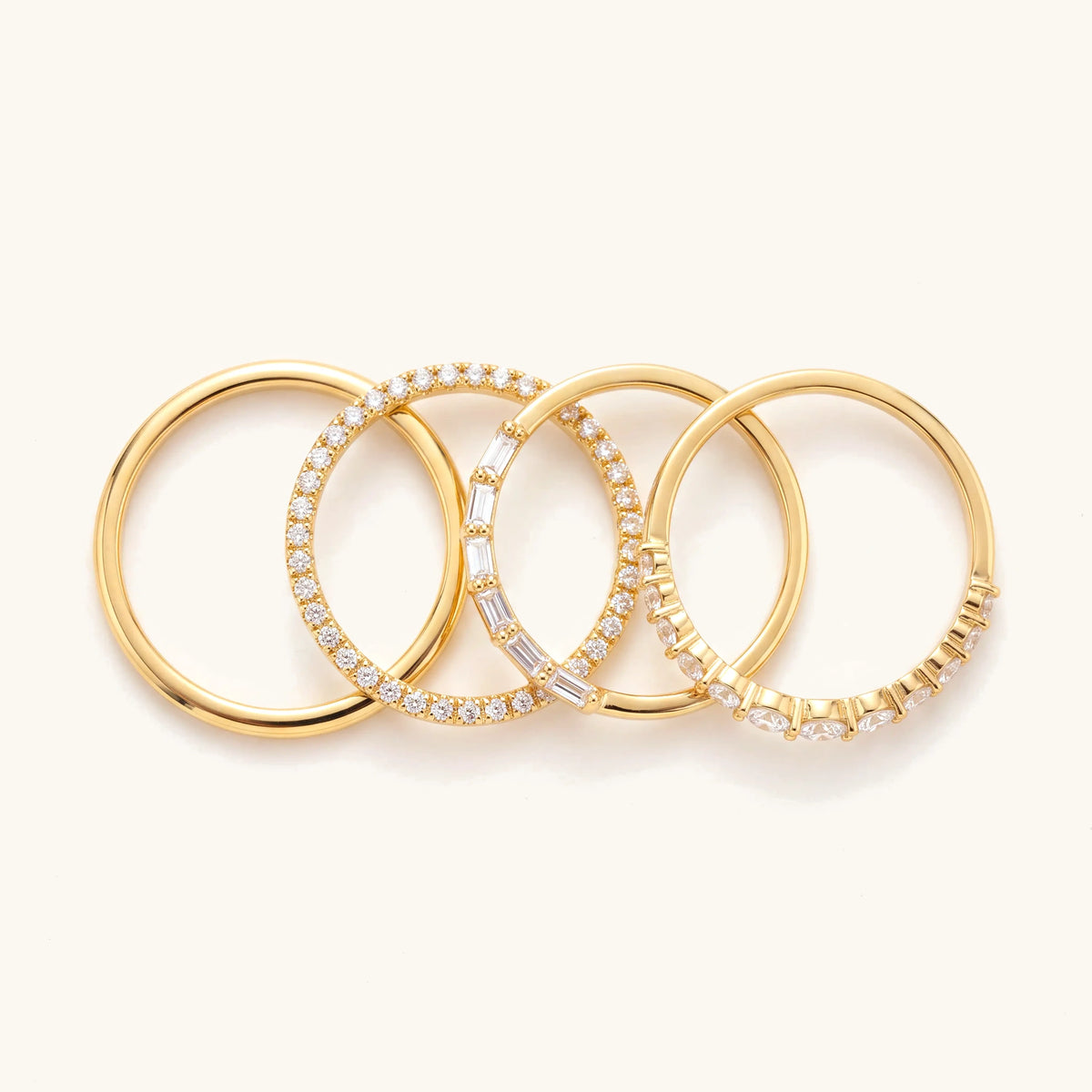 14k 4pc Diamond Accented Ring Stack – the four rings laid out side by side