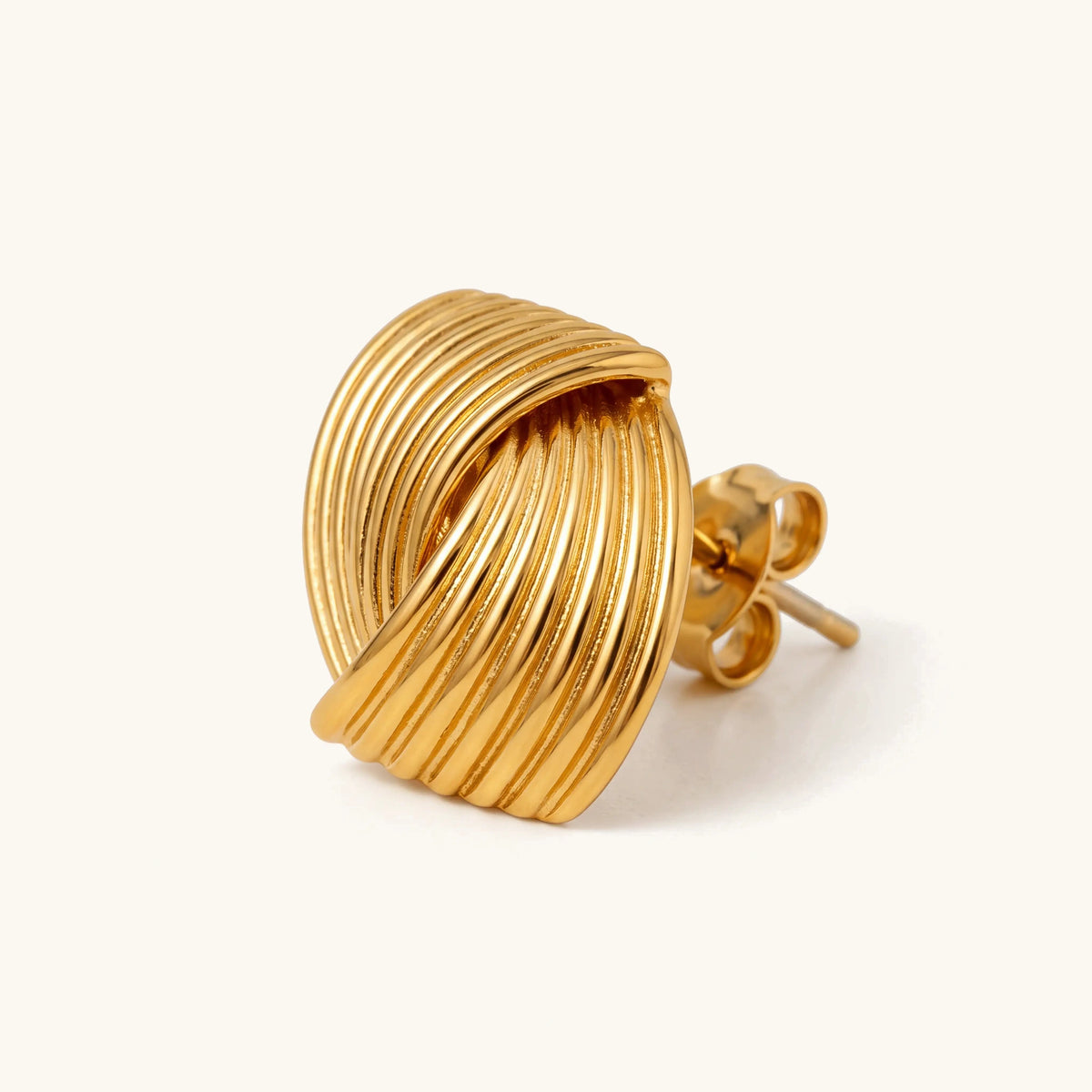 Sonia Gold Wave Earring, side view of the ribbed knot