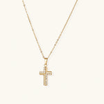 Load image into Gallery viewer, Gold-plated stainless steel cross necklace with crystal embellishments on adjustable chain against light background.
