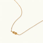 Load image into Gallery viewer, Dainty 18K gold plated necklace with infinity knot pendant on delicate chain against white background
