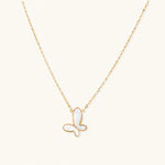 Load image into Gallery viewer, Gold-plated butterfly pendant with iridescent mother of pearl inlay on delicate chain against cream background.
