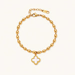 Load image into Gallery viewer, 18K gold-plated oval bead bracelet with a four-leaf clover charm in mother-of-pearl or black enamel, adjustable lobster clasp, on white background.

