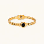 Load image into Gallery viewer, Gold mesh bracelet with circular black mother of pearl medallion featuring Roman numeral engravings and hinged clasp
