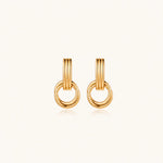 Load image into Gallery viewer, Gold stud earrings with vertical ridged bar connecting to triple interlocking circular rings on white background
