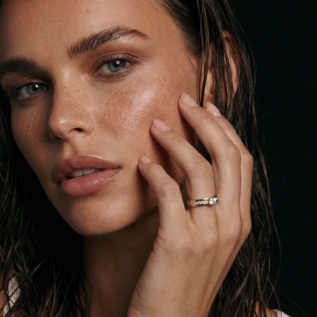 Close-up of Co&Co gold rings worn on the hand