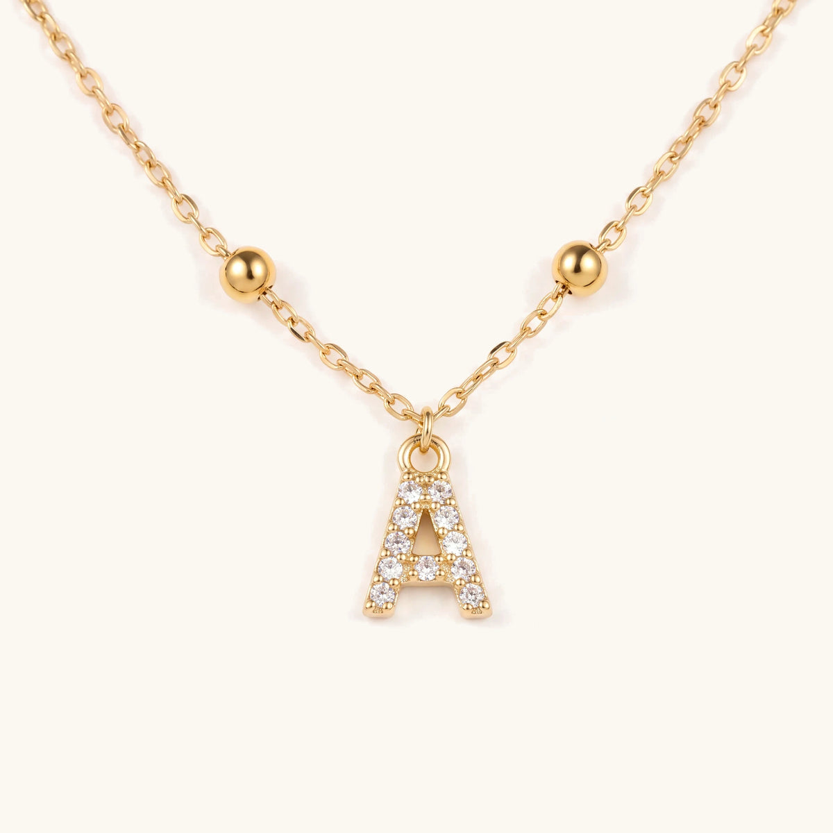 Dainty Beaded Chain Initial Necklace – close-up of the pavé initial pendant