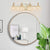 Aestin's 4-Light Golden Wall Vanity Light with Clear Glass Shade