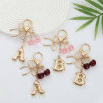 Load image into Gallery viewer, Bubble Initial With Bow &amp; Cherry Charms Keychain
