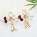 Load image into Gallery viewer, Bubble Initial With Bow &amp; Cherry Charms Keychain
