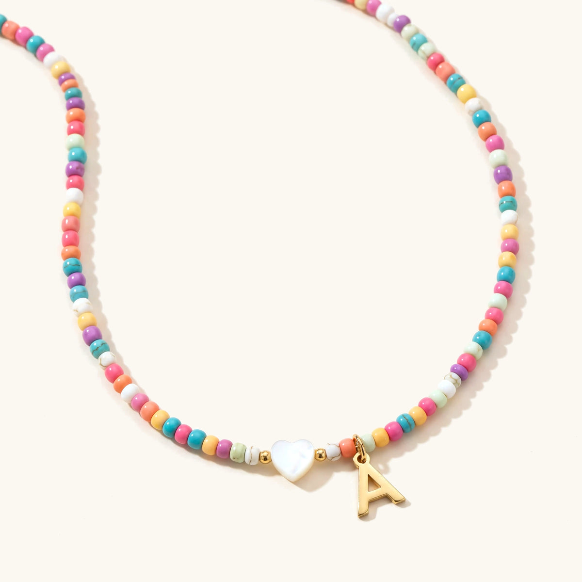 Colorful beaded initial choker necklace with gold letter pendant