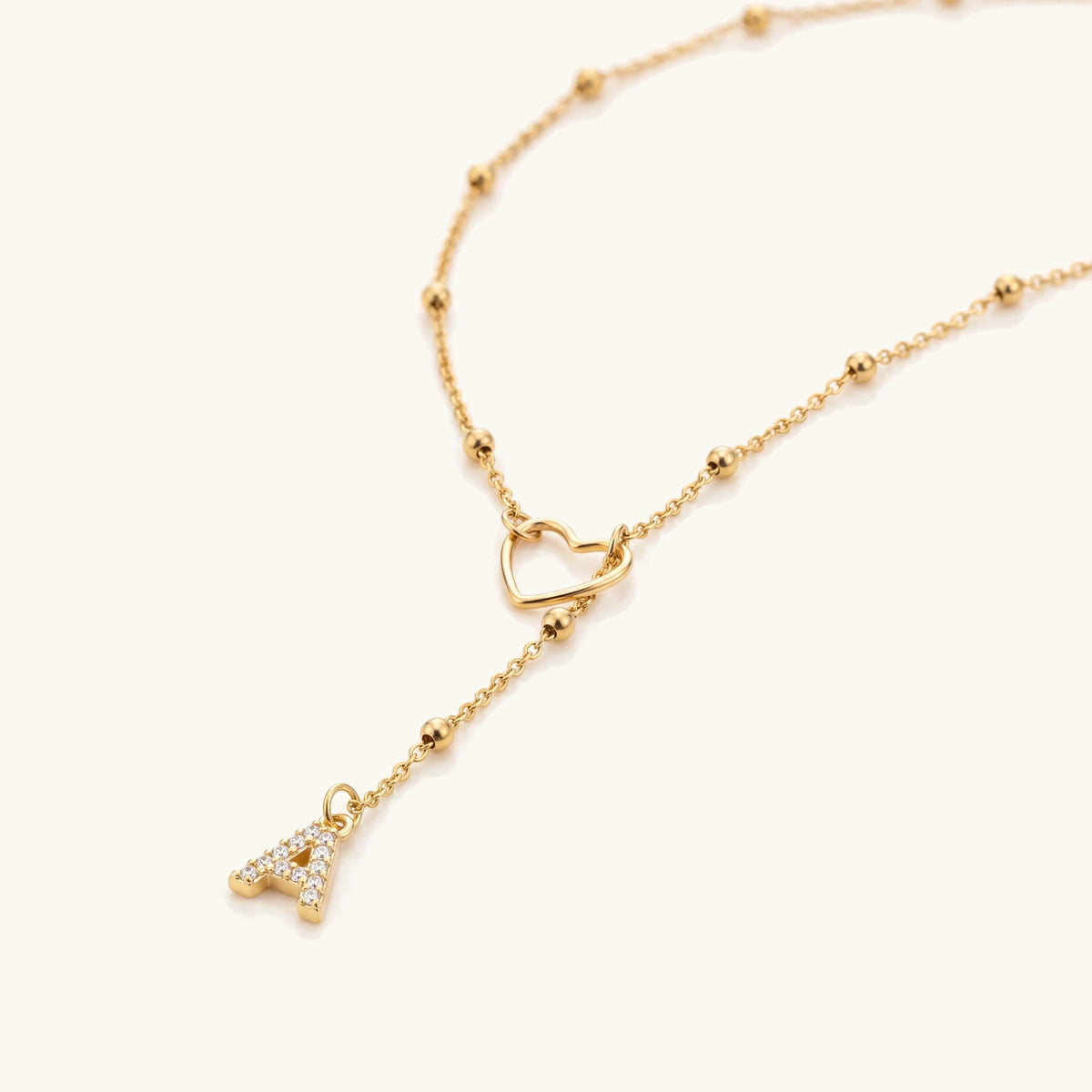 Dainty Diamond Letter Initial Lariat Necklace – close-up of the open heart and pavé initial