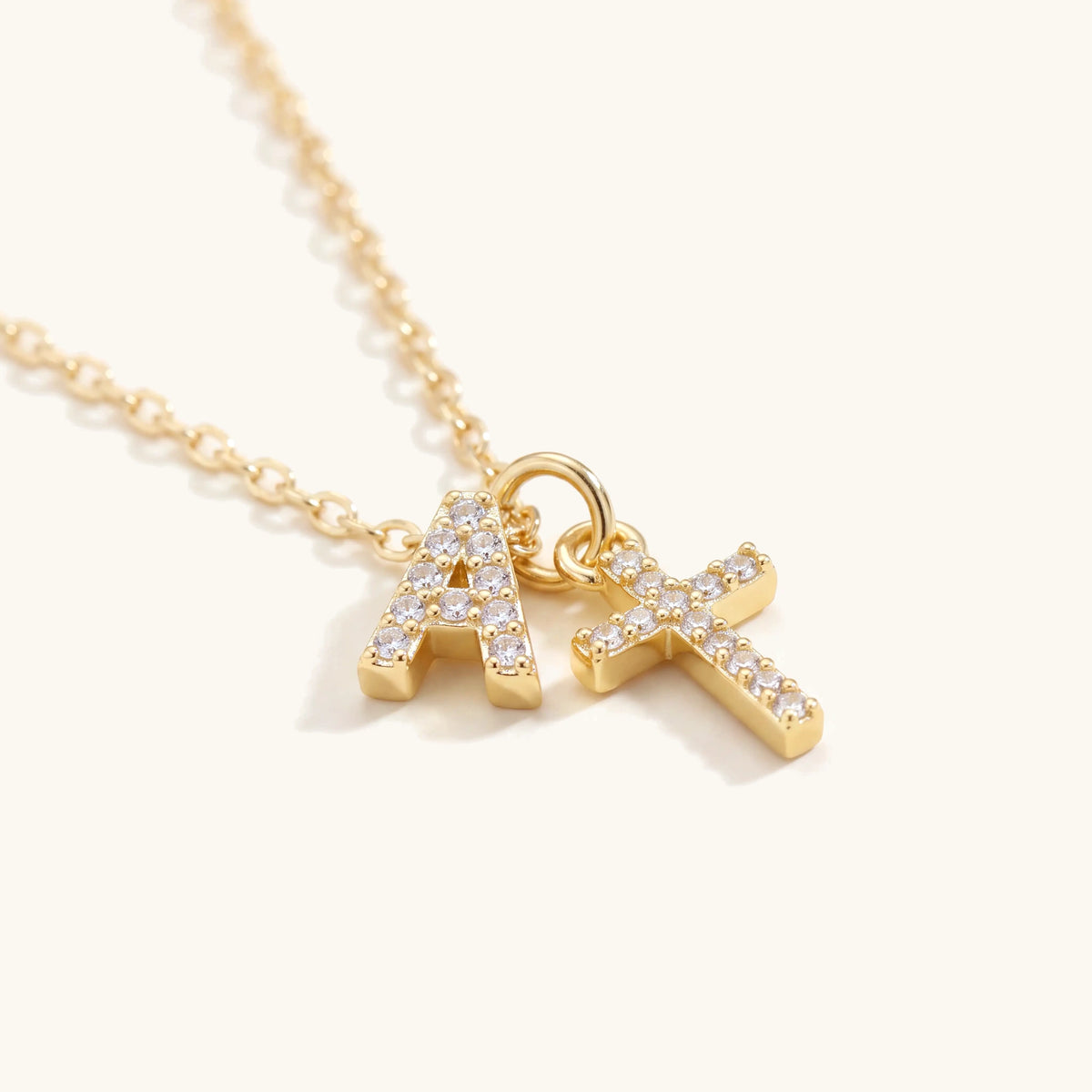 Dainty Diamond Initial & Cross Necklace – close-up of the pavé initial and cross