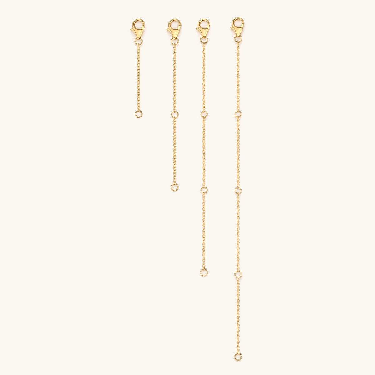 Four gold necklace extenders in 5, 10, 15 and 20 cm lengths
