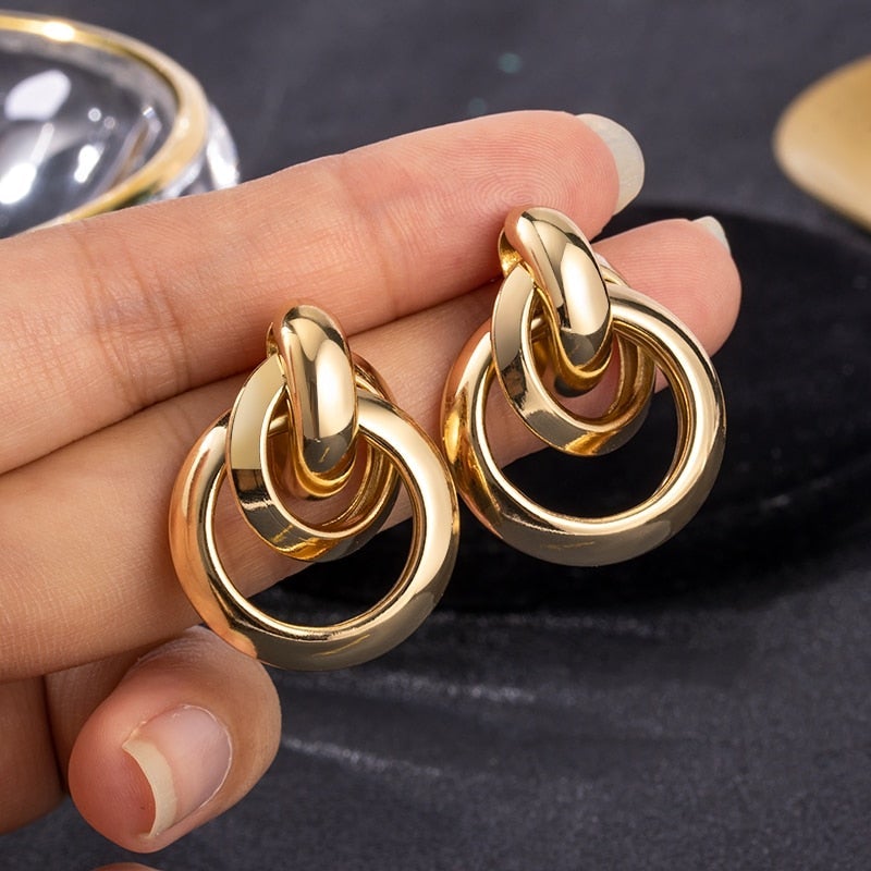 Elegant_gold_earrings_for_women_ _timeless_gold_hoop_earrings_and_minimalist_studs_0
