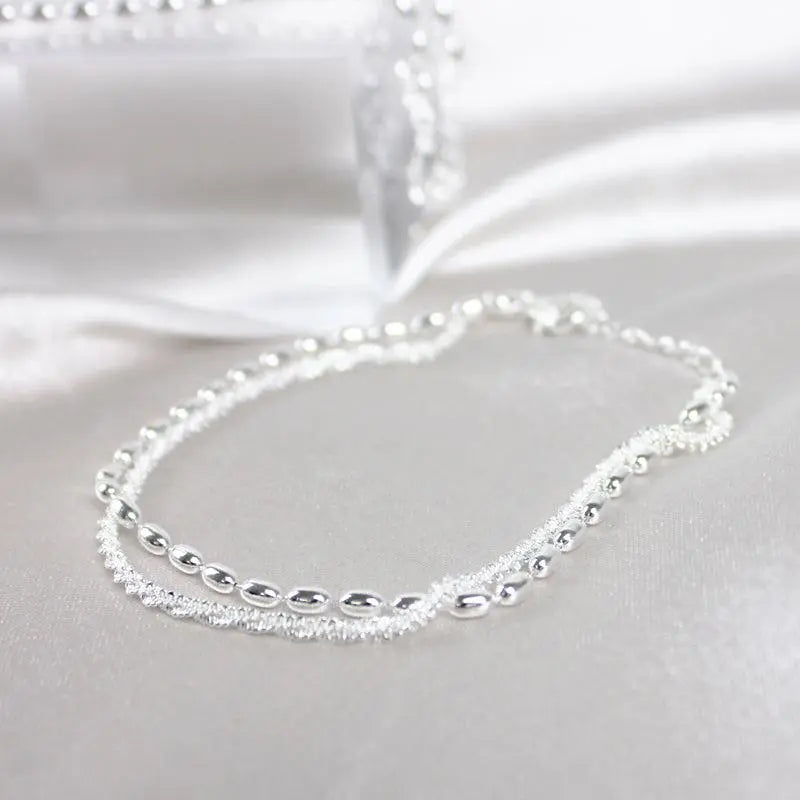Delicate Zirconia Charm Bracelet in Silver