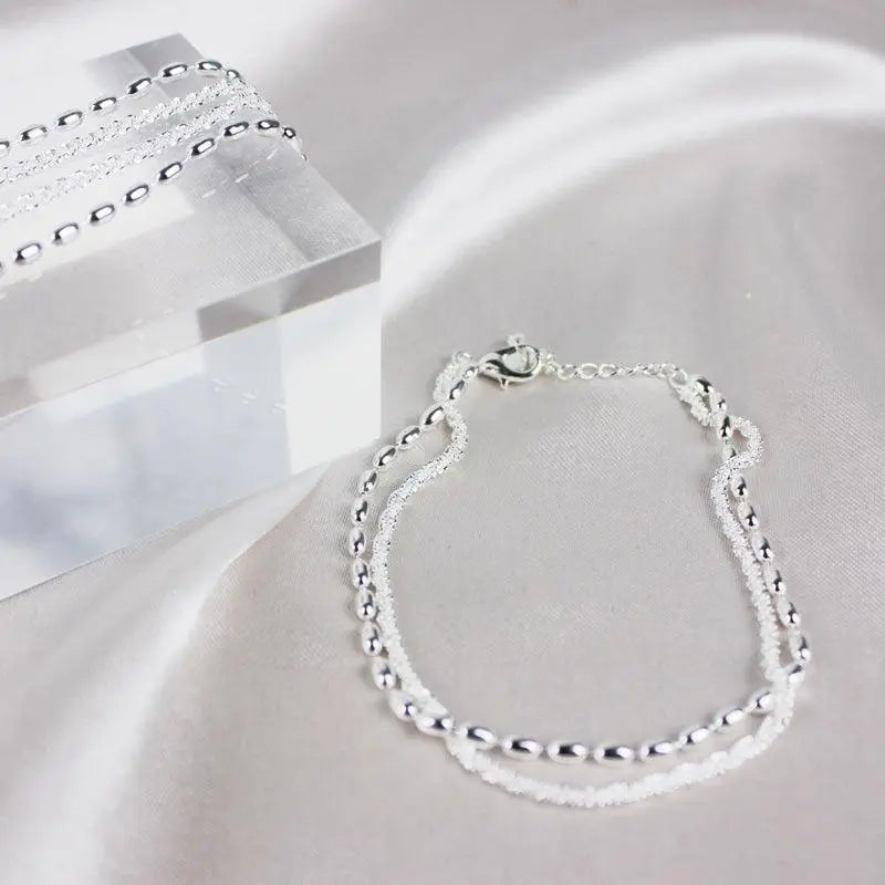 Delicate Zirconia Charm Bracelet in Silver