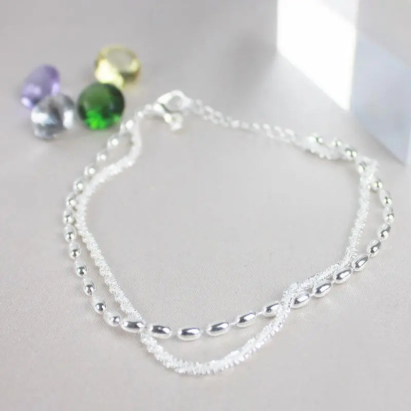 Delicate Zirconia Charm Bracelet in Silver