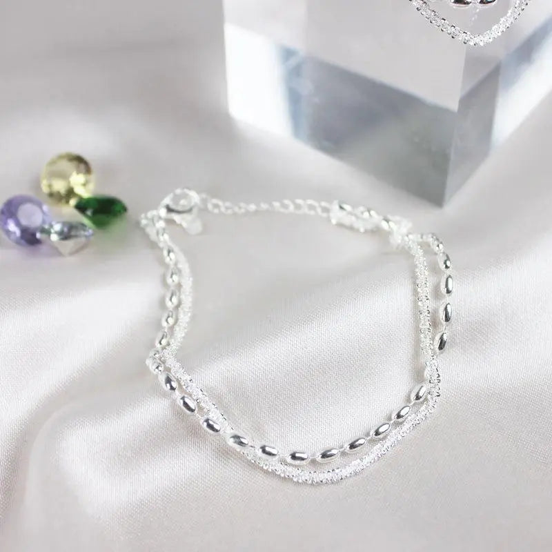 Delicate Zirconia Charm Bracelet in Silver