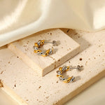 Load image into Gallery viewer, 18k Two Tone Twist Spiral C Hoop Earrings
