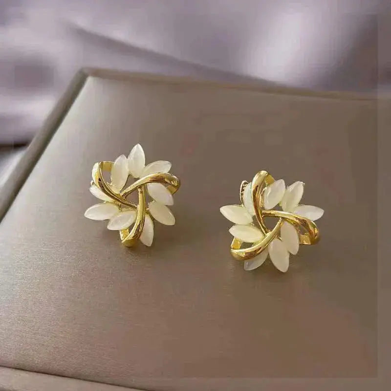 Bohemian white opal leaf stud earrings in gold