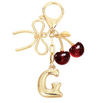 Load image into Gallery viewer, Bubble Initial With Bow &amp; Cherry Charms Keychain
