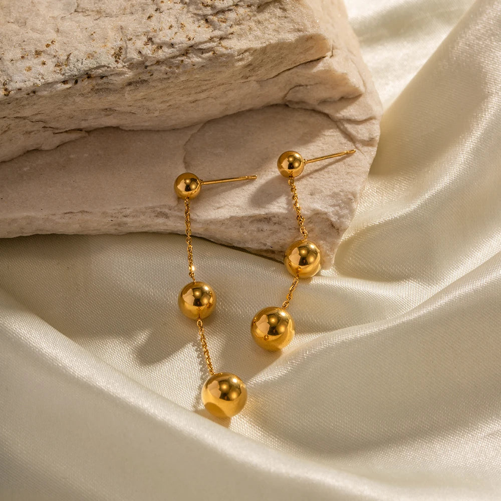 Dangle gold bead tassel earrings
