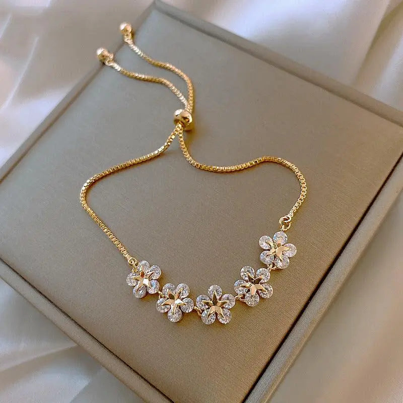 Charming Crystal Daisy Bracelet in Gold