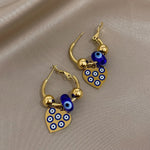 Load image into Gallery viewer, Golden Evil Eye Heart Hoop Earrings
