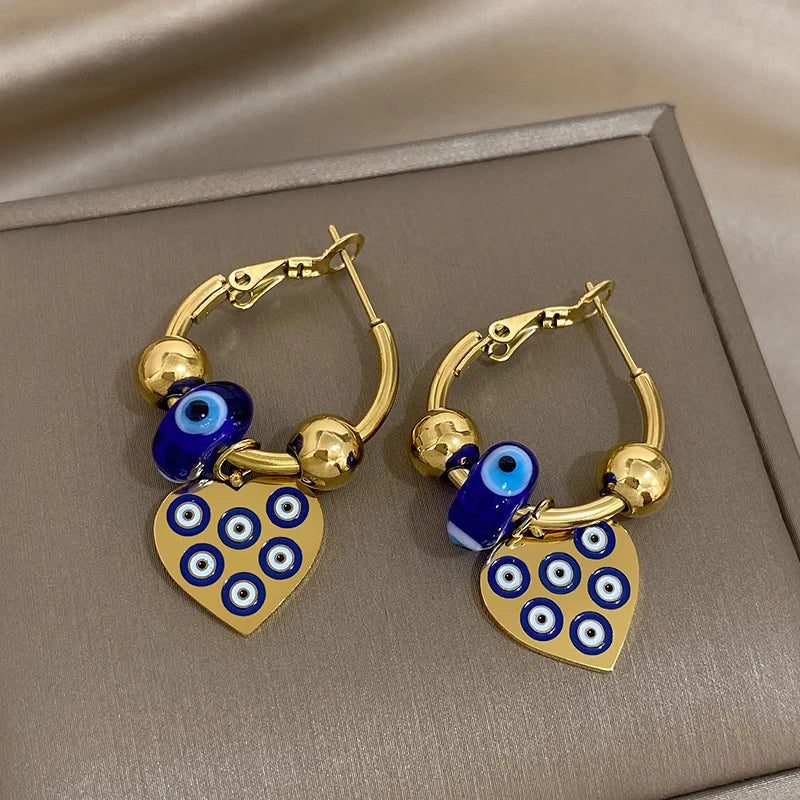 Golden evil eye heart hoop earrings