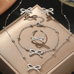 Load image into Gallery viewer, Feminine Bow Satellite Chain Necklace, Bracelet, Earrings, and Ring Set
