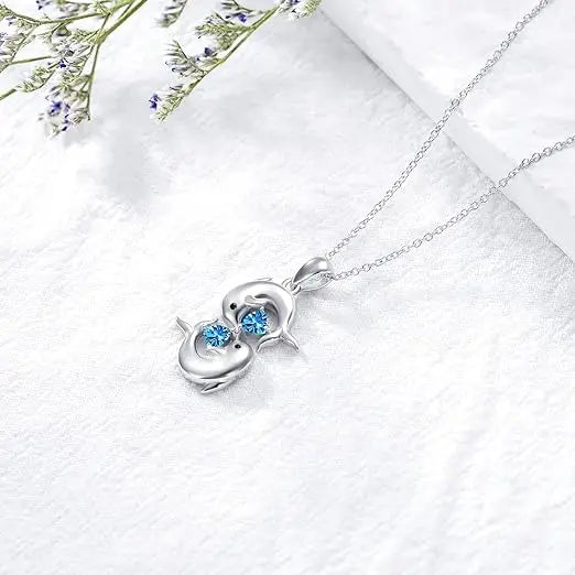 Elegant blue crystal dolphin necklace in silver