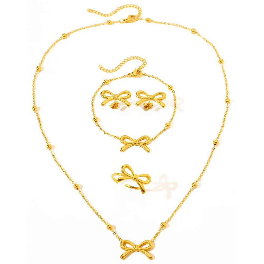Feminine bow satellite chain necklace, bracelet, earrings, and ring set