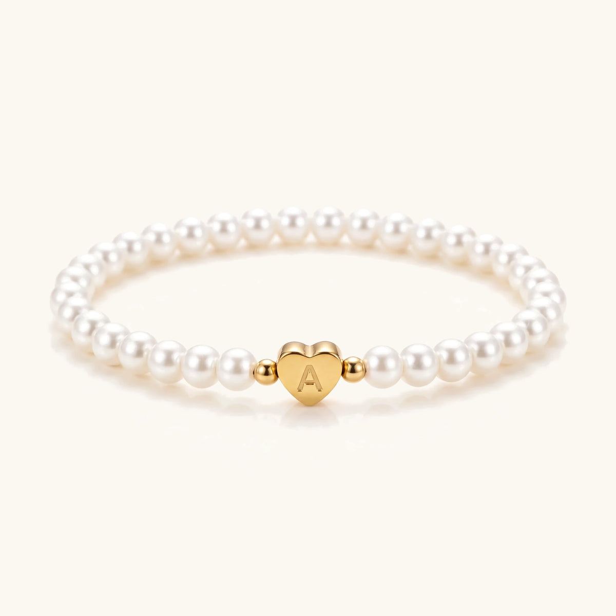 Engraved Initial Heart Bead Bracelet – white pearl stretch bracelet with gold initial heart bead