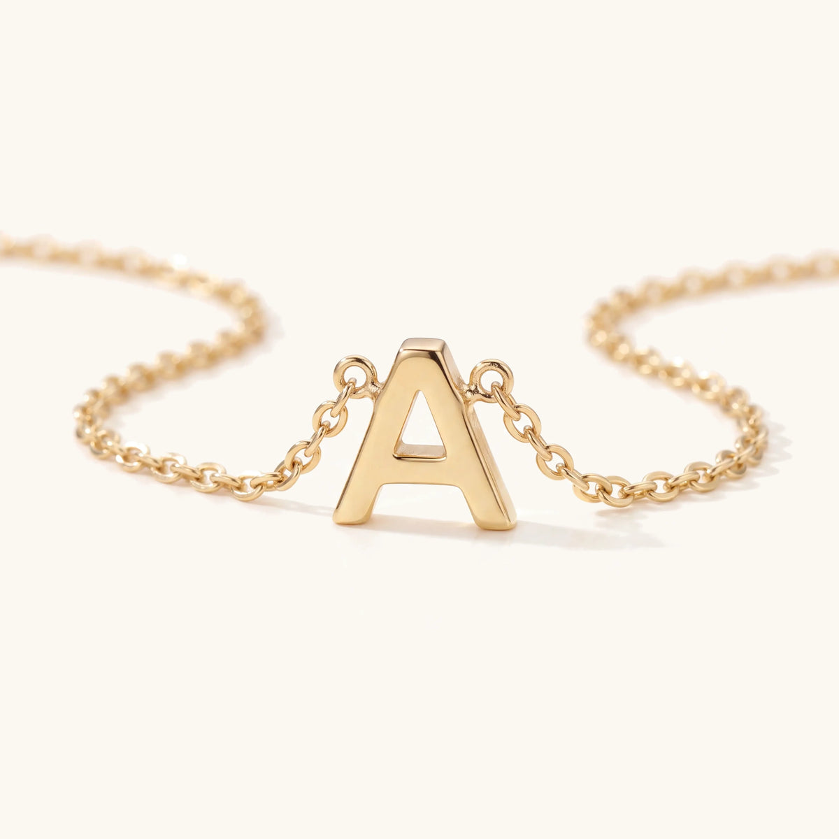 Cecina Initial Letter Necklace – close-up of the gold initial and chain