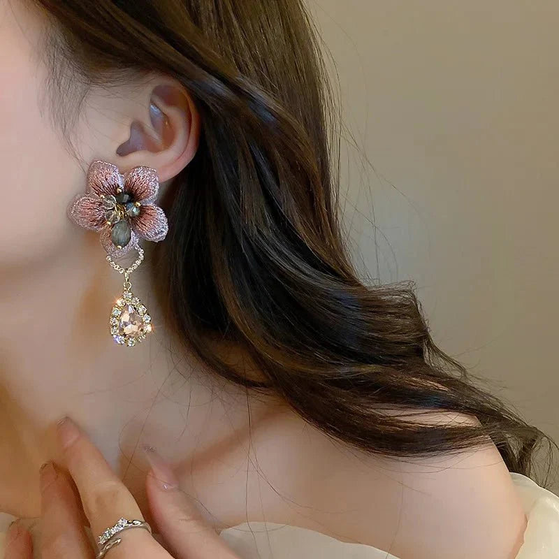Asymmetrical oriental hibiscus crystal earrings