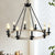 Rustic Farmhouse 10-Light Candle Chandelier in Black Metal and Wood Round