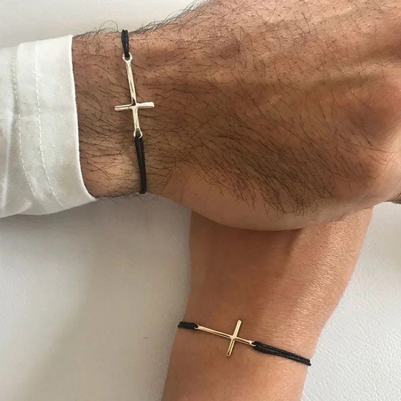 Couples minimal cross bracelets gold cross bracelet worn on a wrist against a white background