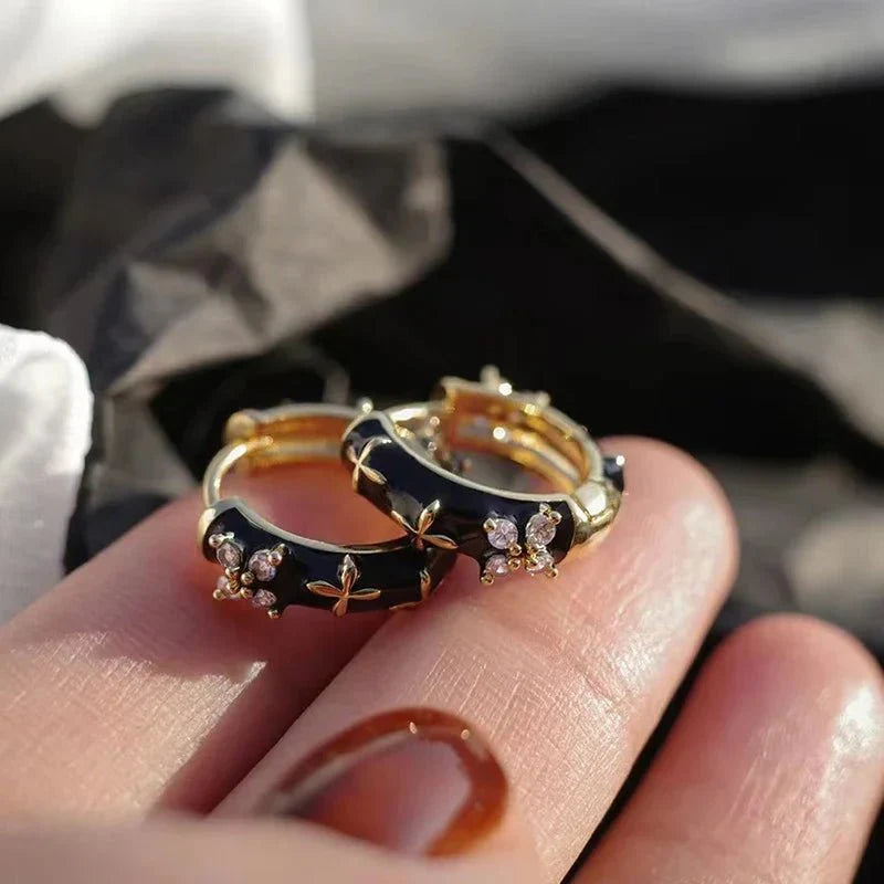 Dainty black and gold floral hoop earrings