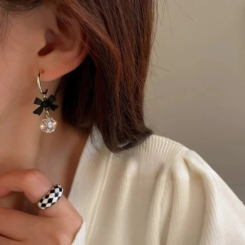 Dainty bow diamond dangle earrings