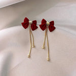 Load image into Gallery viewer, Dainty Bow Gold Dangle Earrings
