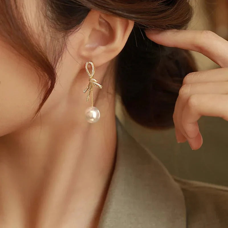 Dazzling bowknot pearl drop earrings 625916